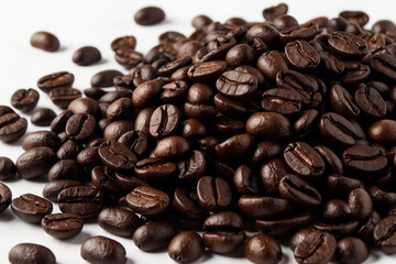 Obraz premium close up of coffee beans on white background.