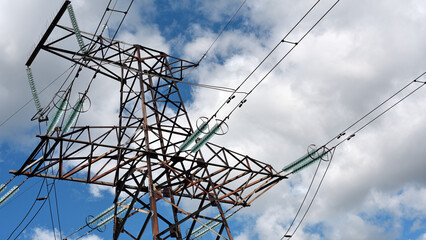 High voltage power line on blue sky background in Sunny day. wires, problems with electricity,...