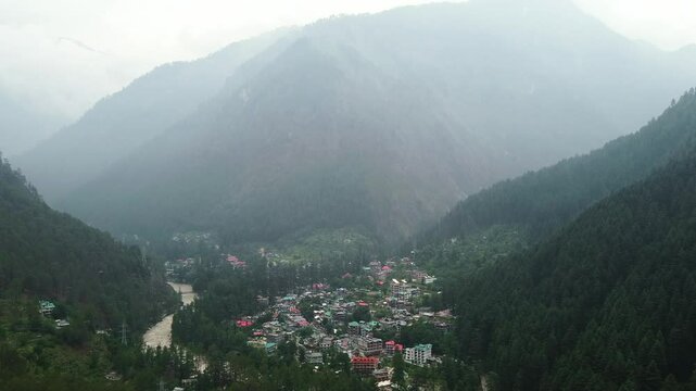 Aerial view of himalayan mountains at kasol himachal pradesh. Small villages and colorful local houses nested in the hills of parvati valley at kasol, himachal pradesh, India.