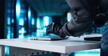 Thief Stealing Laptop Computer From Office