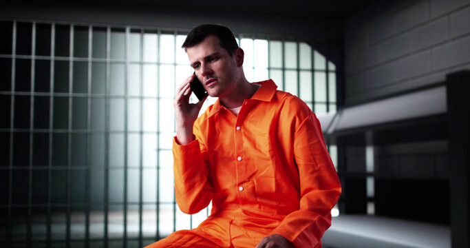 Prisoner Behind Bars In Jail Cell. Crime Punishment