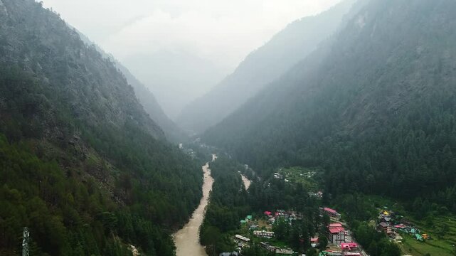Aerial view of himalayan mountains at kasol himachal pradesh. Small villages and colorful local houses nested in the hills of parvati valley at kasol, himachal pradesh, India.