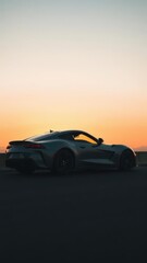 Fototapeta premium Sleek sports car silhouette against sunset sky with modern, aerodynamic design and powerful feel, fast, sporty