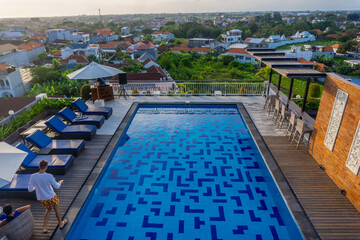 An aerial view of a village in the North Kuta district of Canggu, Bali. sunset and a gentle breeze accompany the view.