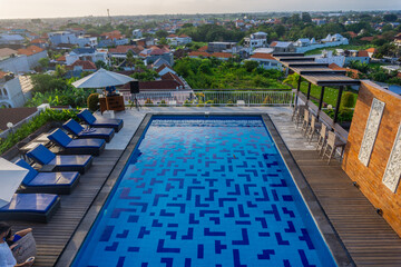 An aerial view of a village in the North Kuta district of Canggu, Bali. sunset and a gentle breeze accompany the view.