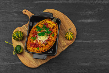 Baked spaghetti squash with spices, herbs and tomato sauce. Gluten free food, healthy dinner, vegan