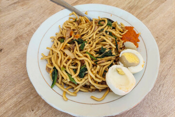 Noodles and Boiled Eggs on a White Plate