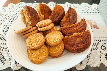 Biscuits and Wet Cakes on a White Plate