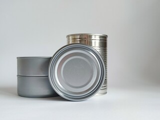 Metal tin cans displayed on a plain white background
