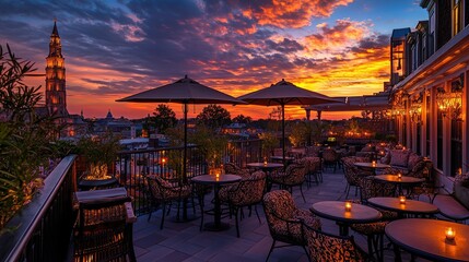 Rooftop patio with sunset view over city skyline.