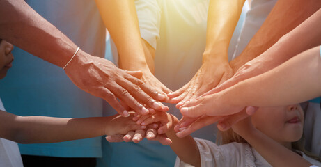 Hands of diversity volunteer people join hands together for help garbage collection charity outdoor. Volunteer and charity environment concept