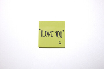 Love and motivational message on a sticky notes with isolated white background