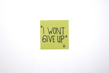 Motivational and love message on a sticky notes with isolated white background.