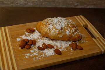 Almond croissant with powdered sugar
