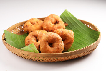 Medu Vada, a popular South Indian food served with Sambar ,Green coconut chutney ,Vada ,Medu vadai with sambar - Popular South Indian snack