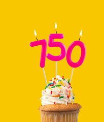 Candles forming the number 750 - Yellow background