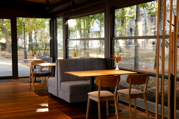 Stylish cafe with large windows. Interior design