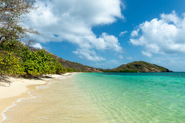 View of tropical white sand beach and Point Cistern on Carriacou, Grenada in the Caribbean