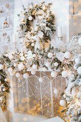 Stunning winter decor featuring a snowy wreath and elegant ornaments