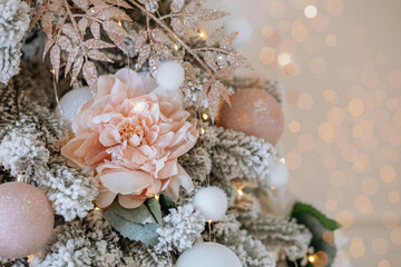 Elegant decorations on a Christmas tree with soft colors and lights for 2025