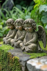 Always loved and remembered. Three serene angel statues adorned with lush greenery.