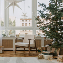 Elegant Christmas setup with subtle lighting, greenery, and festive ornaments. A serene space ready for holiday celebrations.