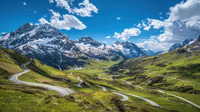 The stunning beauty of the Susten Pass, with its winding roads, snow-capped peaks, and clear blue skies