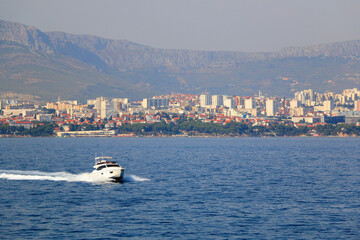 Contemporary buildings, gardens and beaches at the waterfront in Split, Croatia. View of Split from the boat.