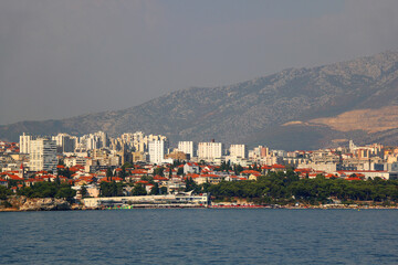 Obraz premium Contemporary buildings, gardens and beaches at the waterfront in Split, Croatia. View of Split from the boat.