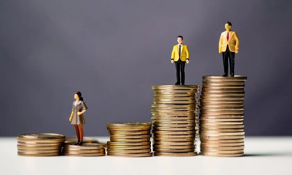 gender pay gap inequality concept with coins and miniature figure