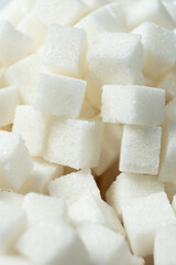 Cubes of white crystalline beetroot refined sugar.