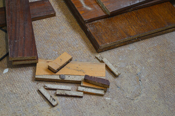 collection of wooden planks and scraps remnants of a carpentry project particleboard textured woodworking DIY material reuse repurposing wood minimize waste cutting techniques furniture construction