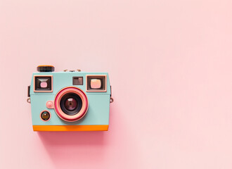 Cute romantic polaroid camera on pastel pink background.