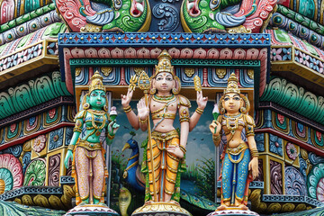 Colored decorations and statues on the exterior of the Hindu Temple Sri Maha Mariamman Temple (