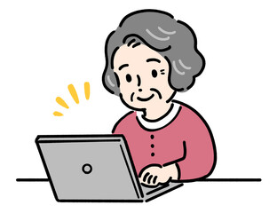 パソコンを使う笑顔の高齢者女性