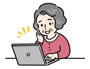 パソコンを使う笑顔の高齢者女性