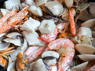 Fresh seafood medley with shrimp, clams, mussels, and squid