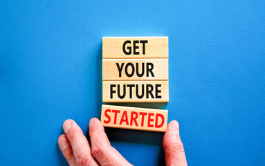 Get your future started symbol. Concept words Get your future started on beautiful wooden blocks. Businessman hand. Beautiful blue background. Business get your future started concept. Copy space.