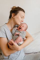 Mother and baby. Loving mom with her little two week old child