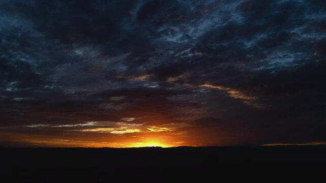 Dramatic Storm Clouds at Sunrise Timelapse Wide Shot