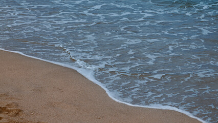Soft turquoise wave on the coast, Mediterranean sea, Sardinia, Italy