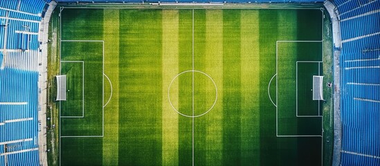 Obraz premium Aerial view of a soccer field inside a stadium.