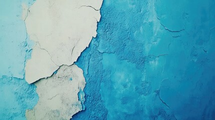 Obraz premium Textured colorful wall background with peeling blue and beige paint revealing weathered layers and artistic imperfections.