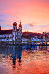 Splended sunset over the  Jesuit church in the evening and Rathaussteg in Christmas illumination,...