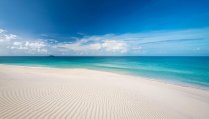 white sand curve or tropical sandy beach with blurry blue ocean and blue sky background image for nature background or summer background