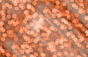 Abstract background with glitter bokeh. Blurred festive and sparkling lights. Party concept. Circle shape bokeh. Illuminating  Color Of The Year 2025 - Mocha Mousse