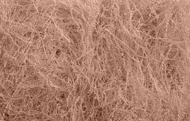 Shredded paper texture, filling for gift box, stuffing and shipping. Brown decorative straws fillers for product placement. Paper trash texture. Selective focus. Mocha Mousse, Color of the Year 2025.