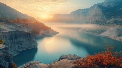 Serene lake landscape during golden hour with mist and soft sunlight reflecting on tranquil waters amidst mountains and colorful foliage