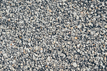 Gravel texture background with small stones in various shades of gray. Ideal for construction,...