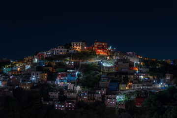 Colorful dense houses in Guanajuato, Mexico at night